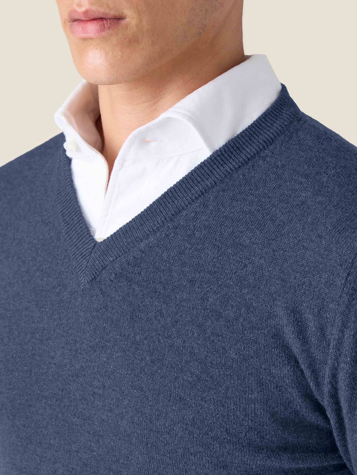 Close-up of a man wearing the Atlantic Blue Cashmere V-Neck over a white collared shirt, showing the ribbed neckline detail.