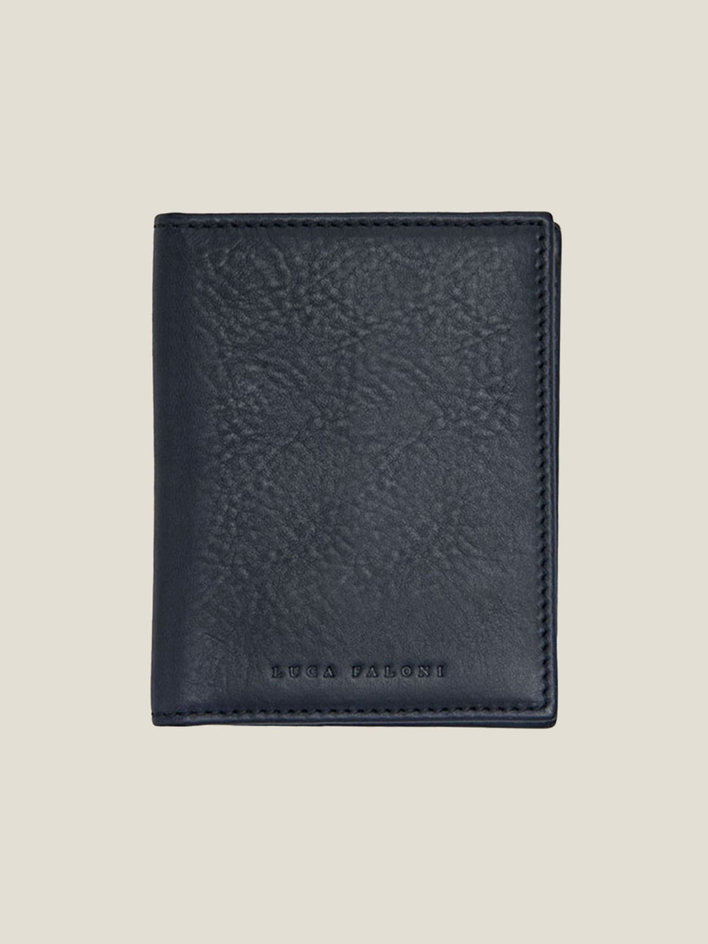 Front view of the Luca Faloni Bifold Cardholder in ink blue Italian leather, shown closed against a plain background.
