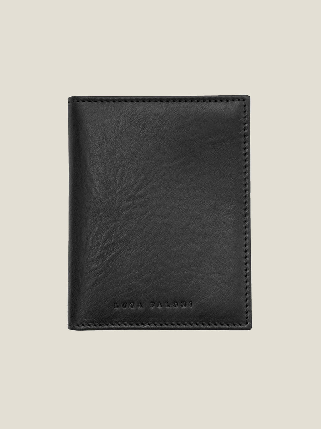 Front view of the Luca Faloni bifold cardholder in black vegetable-tanned leather, shown closed.