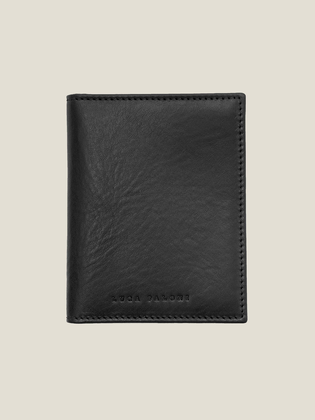 Front view of the Luca Faloni bifold cardholder in black vegetable-tanned leather, shown closed.