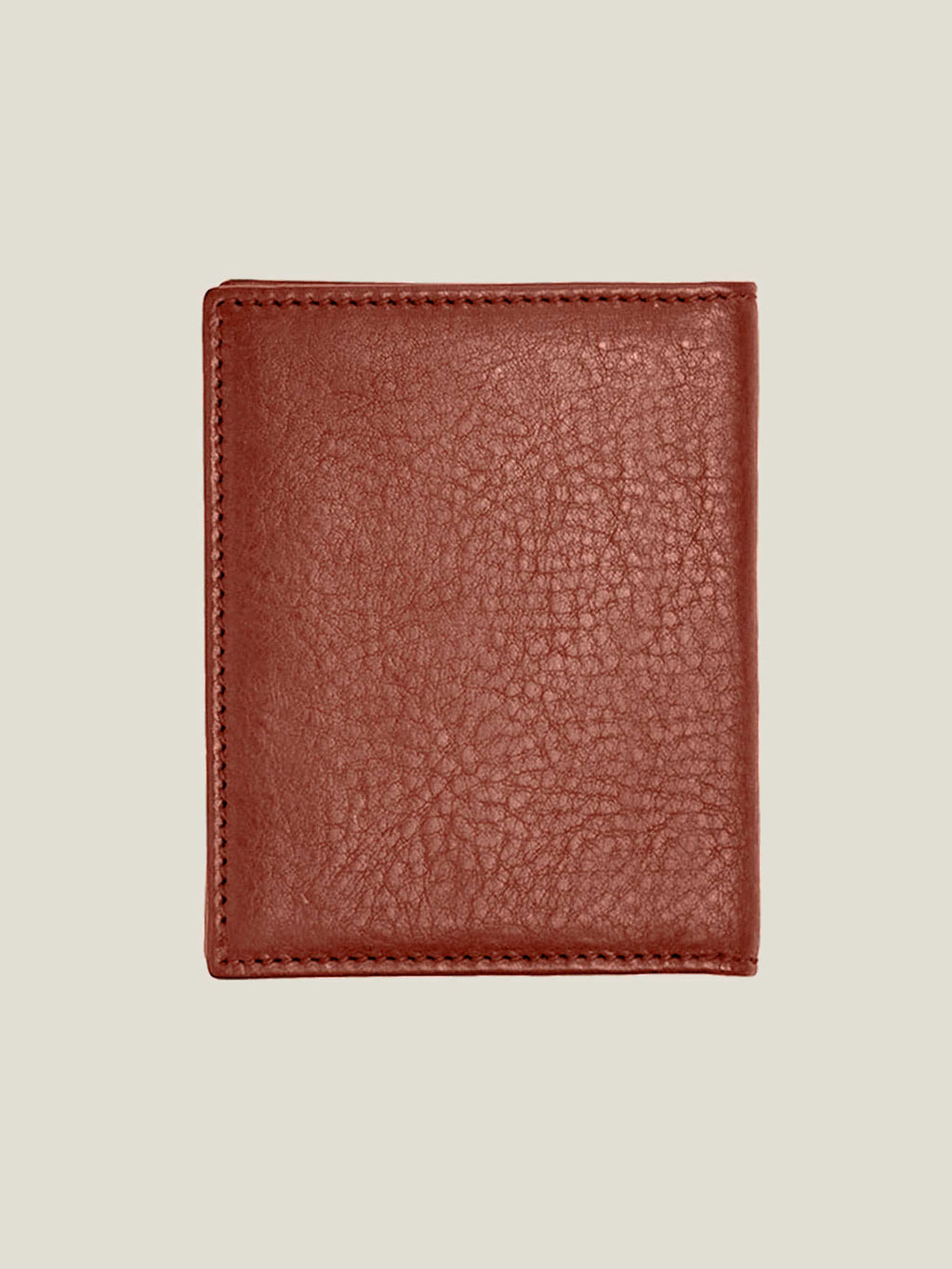 Closed back view of the Bifold Cardholder in caramel brown, showing the rich texture of the full-grain Italian leather.