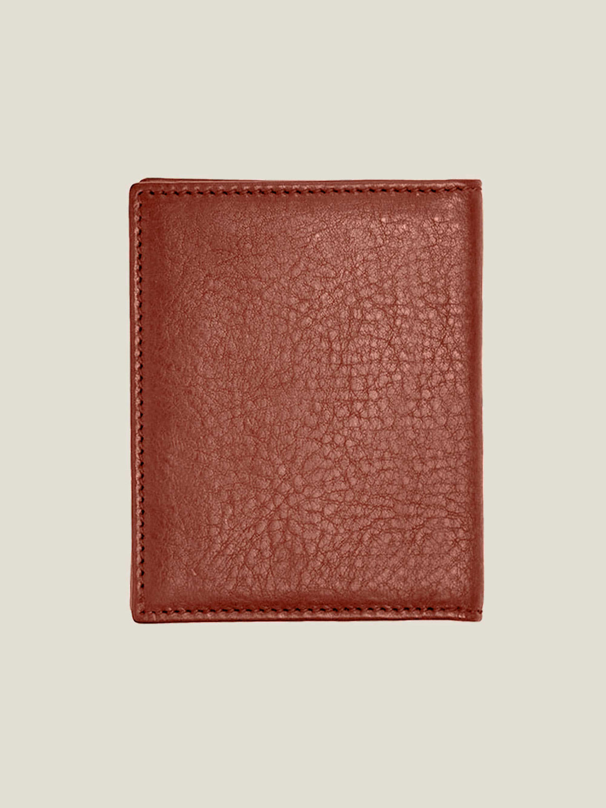 Closed back view of the Bifold Cardholder in caramel brown, showing the rich texture of the full-grain Italian leather.