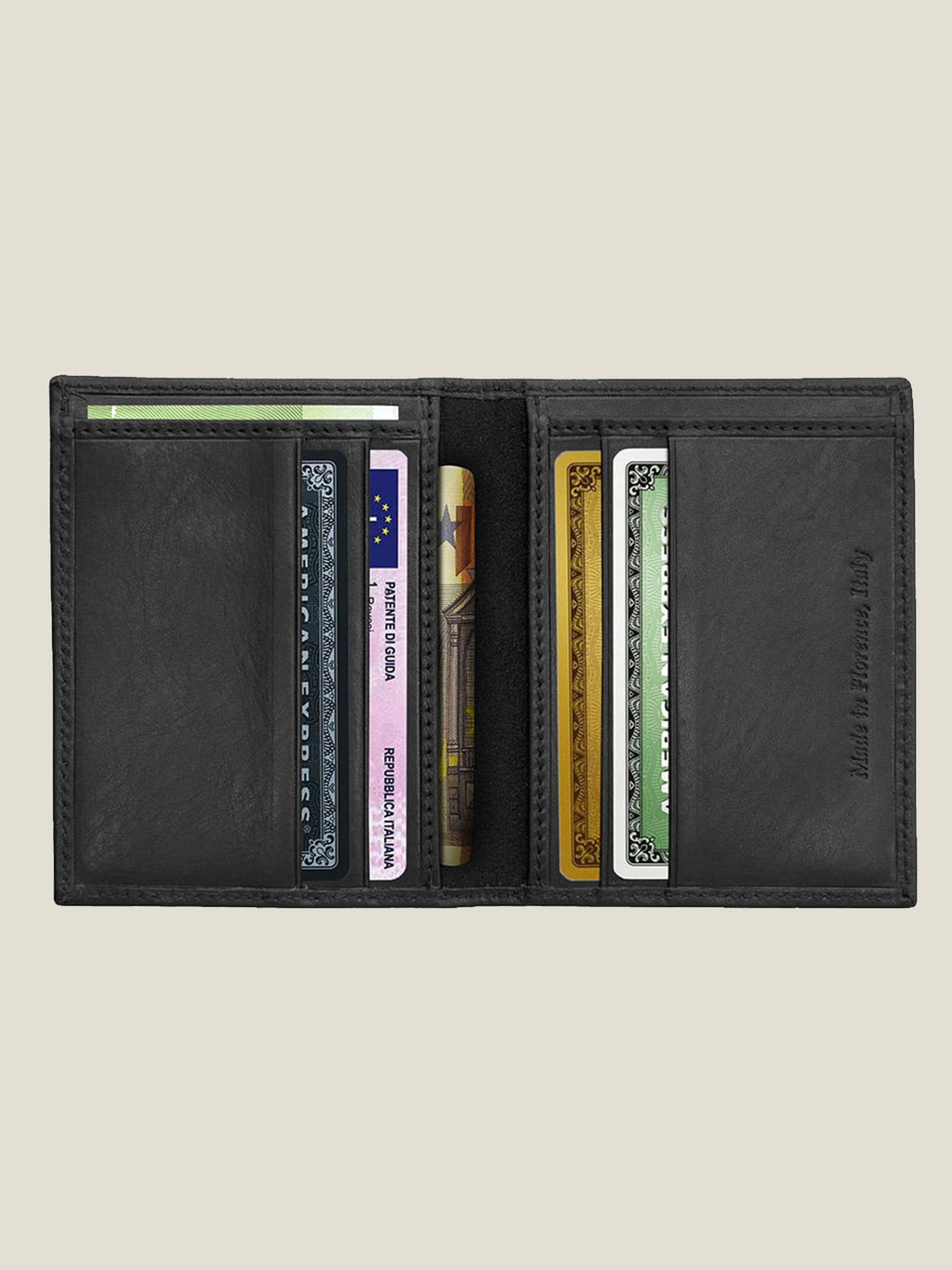 Interior view of the black leather Bifold Cardholder, open to show its card slots and sleeves filled with cards and bills.