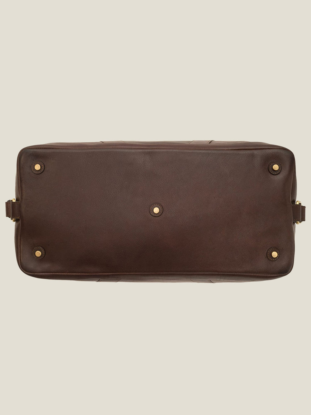 Bottom view of the Luca Faloni Chocolate Brown Leather Weekender bag, showing the five protective metal studs on the base.