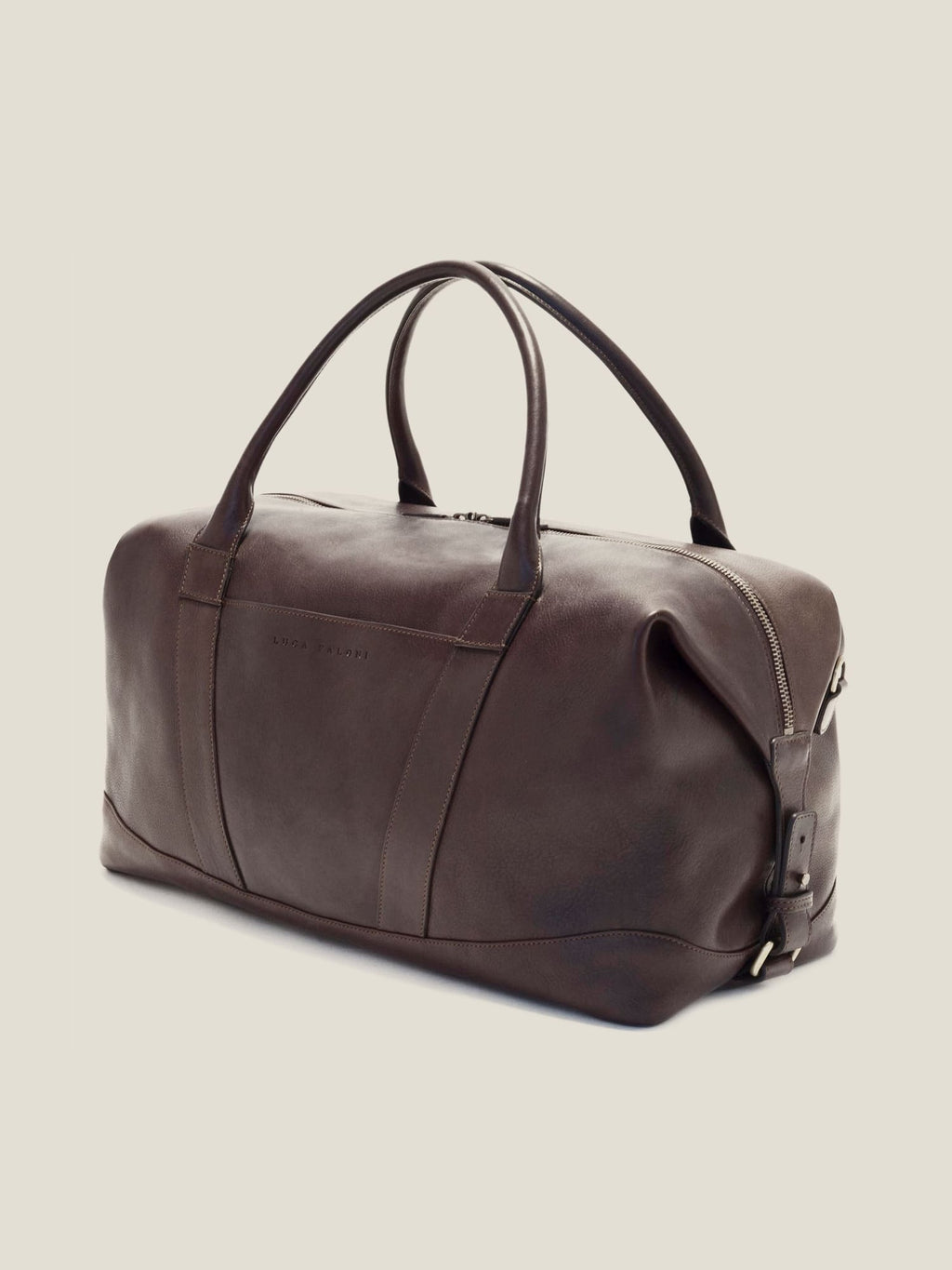 Side profile of the Luca Faloni Weekender travel bag in Chocolate Brown leather against a neutral studio background.