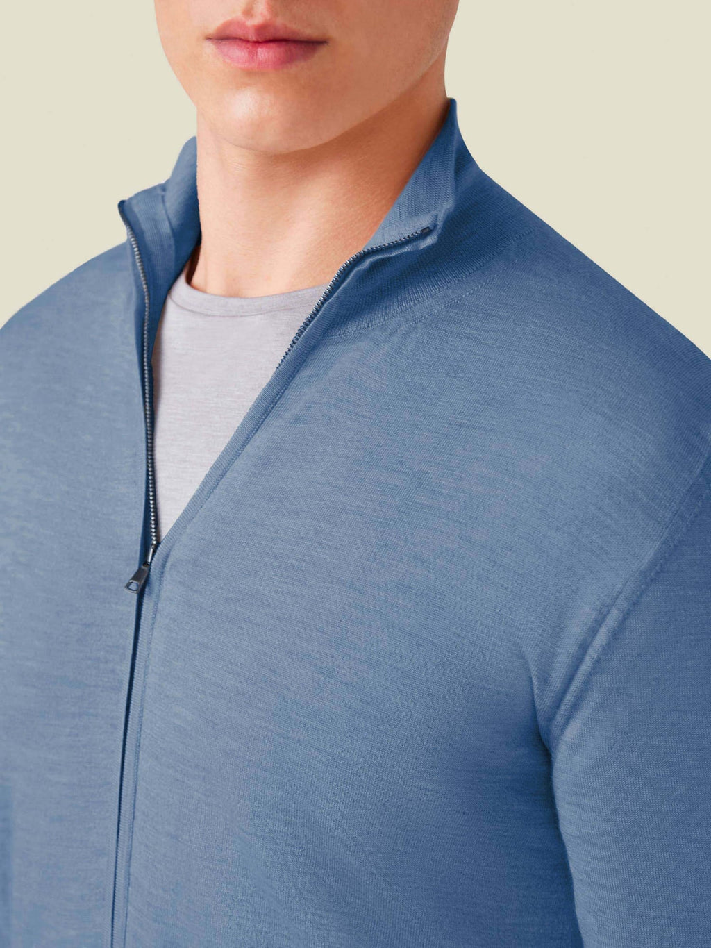 A close-up of the Azure Silk-Cashmere Zip Cardigan, showing the details of the funnel neck, zip and fine knit texture.