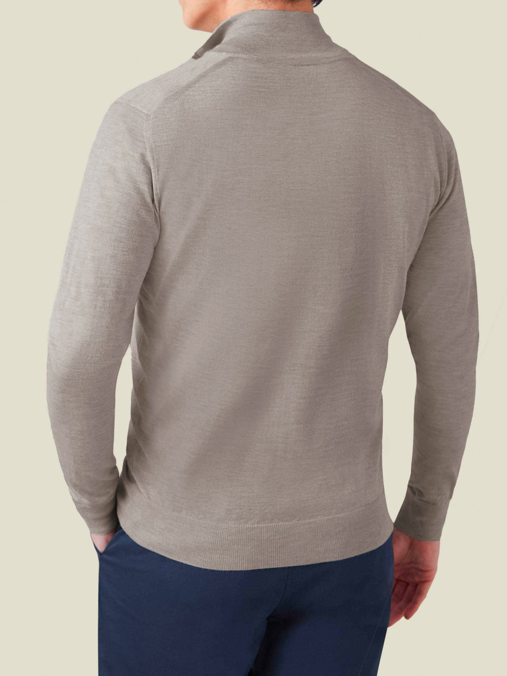 Back view of a model wearing the Nocciola Brown Silk-Cashmere Zip Cardigan, showcasing the garment's fit and drape.