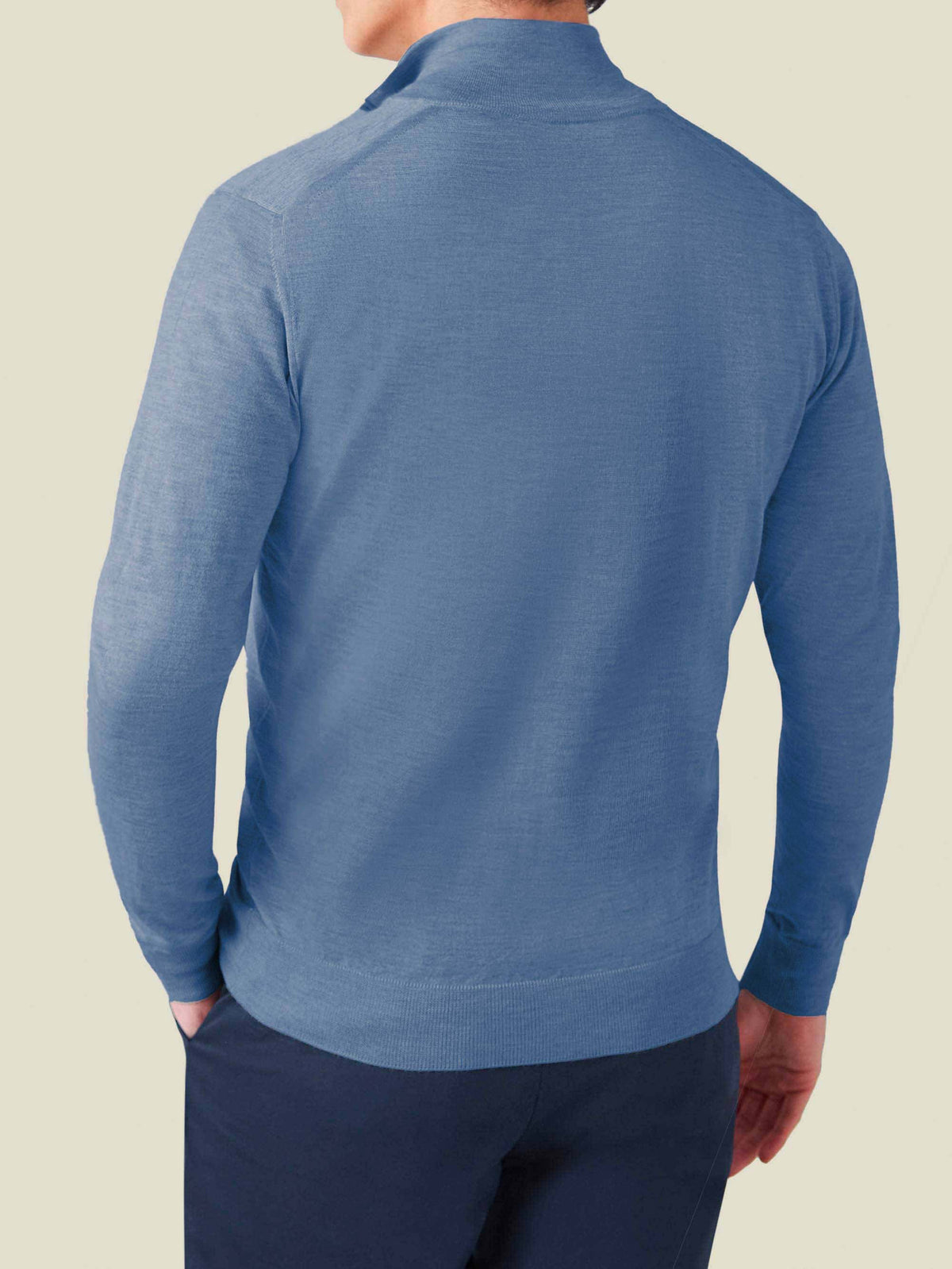 Rear view of a model wearing the Azure Silk-Cashmere Zip Cardigan, showcasing the fit and fine knit.