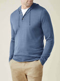 Front view of a man wearing the Luca Faloni Silk-Cashmere Hoodie in Azure with a white T-shirt and khaki chinos.