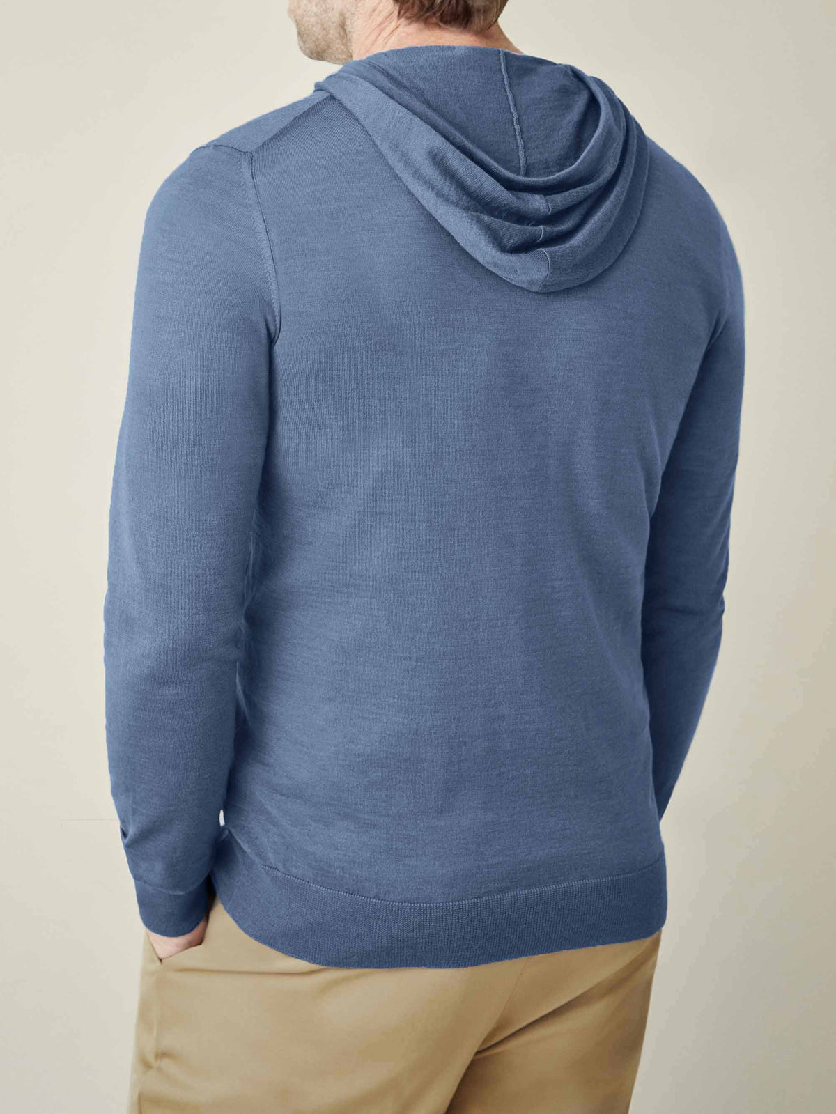 Back view of a man wearing the Luca Faloni Silk-Cashmere Hoodie in Azure.
