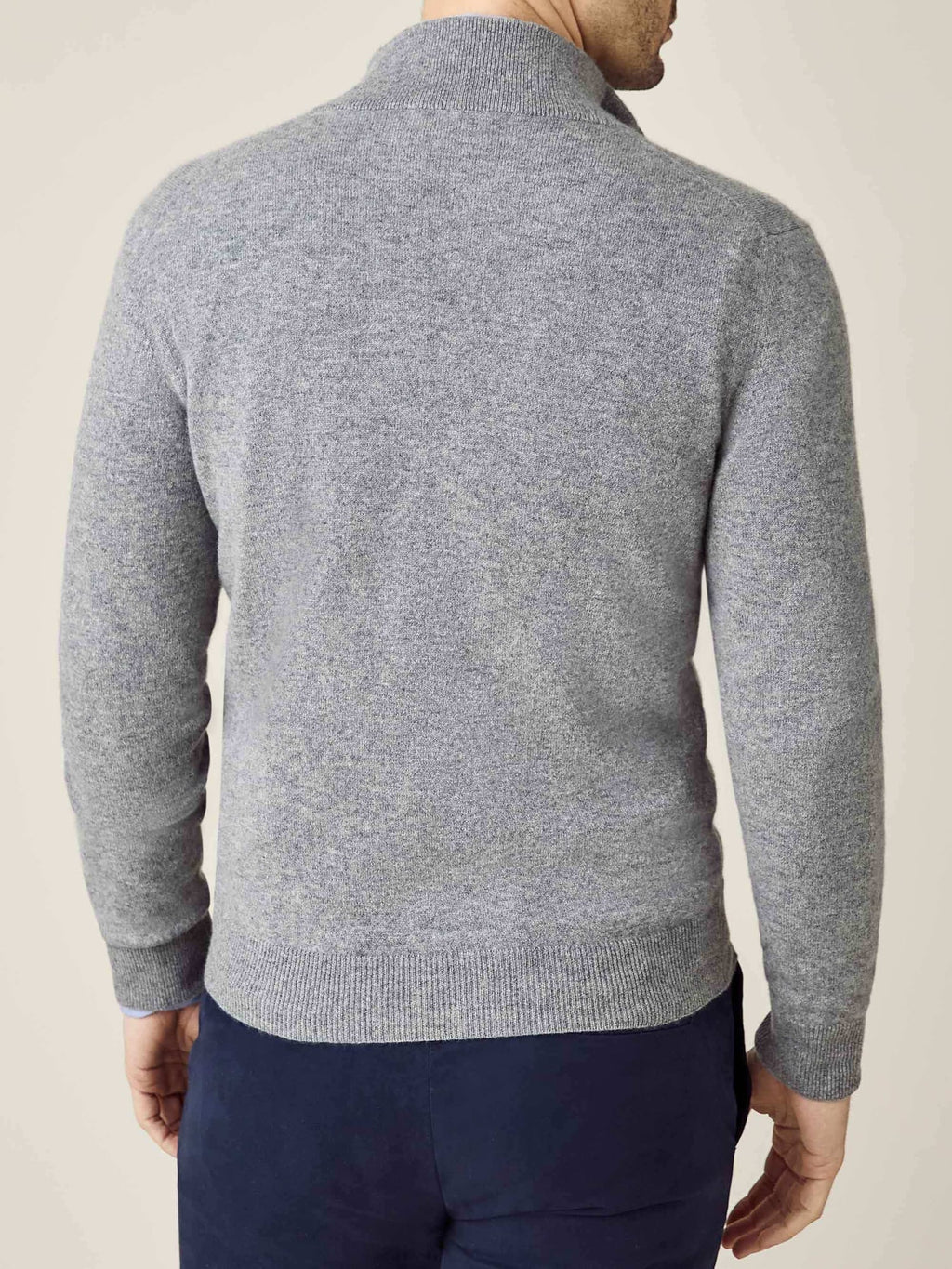Back view of a model wearing the Luca Faloni Cashmere Zip Cardigan in Dolomiti Grey, showing the fit and silhouette.