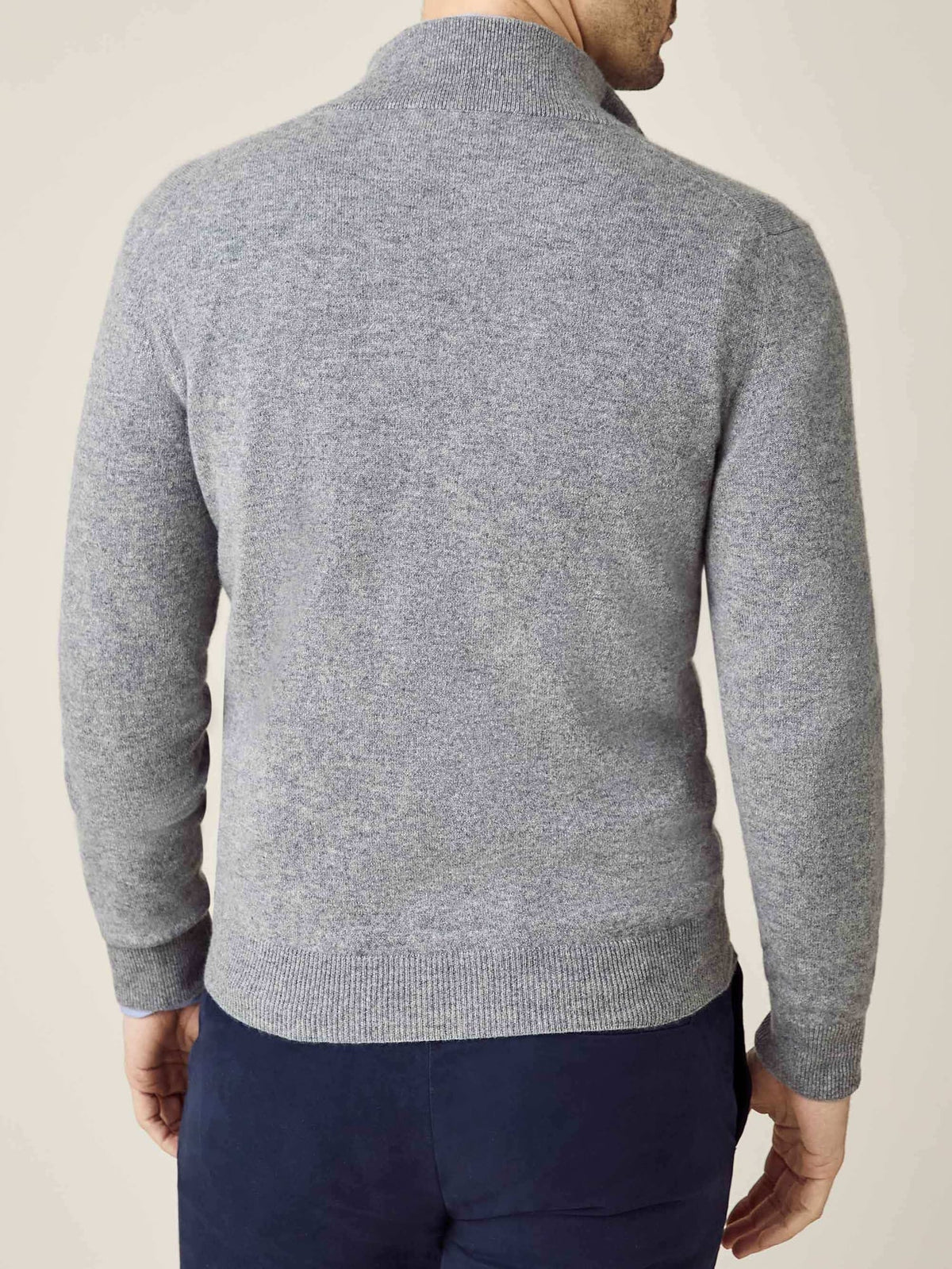 Back view of a model wearing the Luca Faloni Cashmere Zip Cardigan in Dolomiti Grey, showing the fit and silhouette.