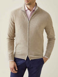 Model wears the Luca Faloni Camel Beige Cashmere Zip Cardigan over a pink shirt and navy trousers.
