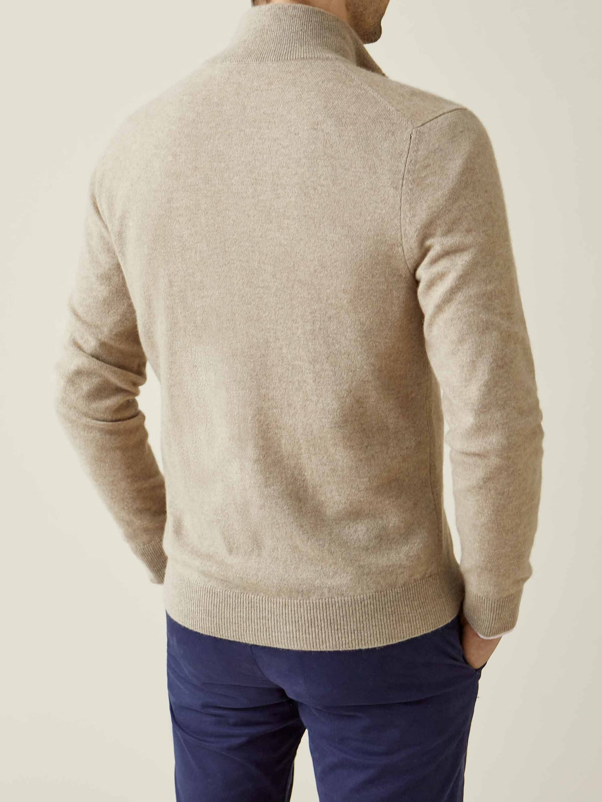Back view of a man wearing the Luca Faloni Cashmere Zip Cardigan in Camel Beige.