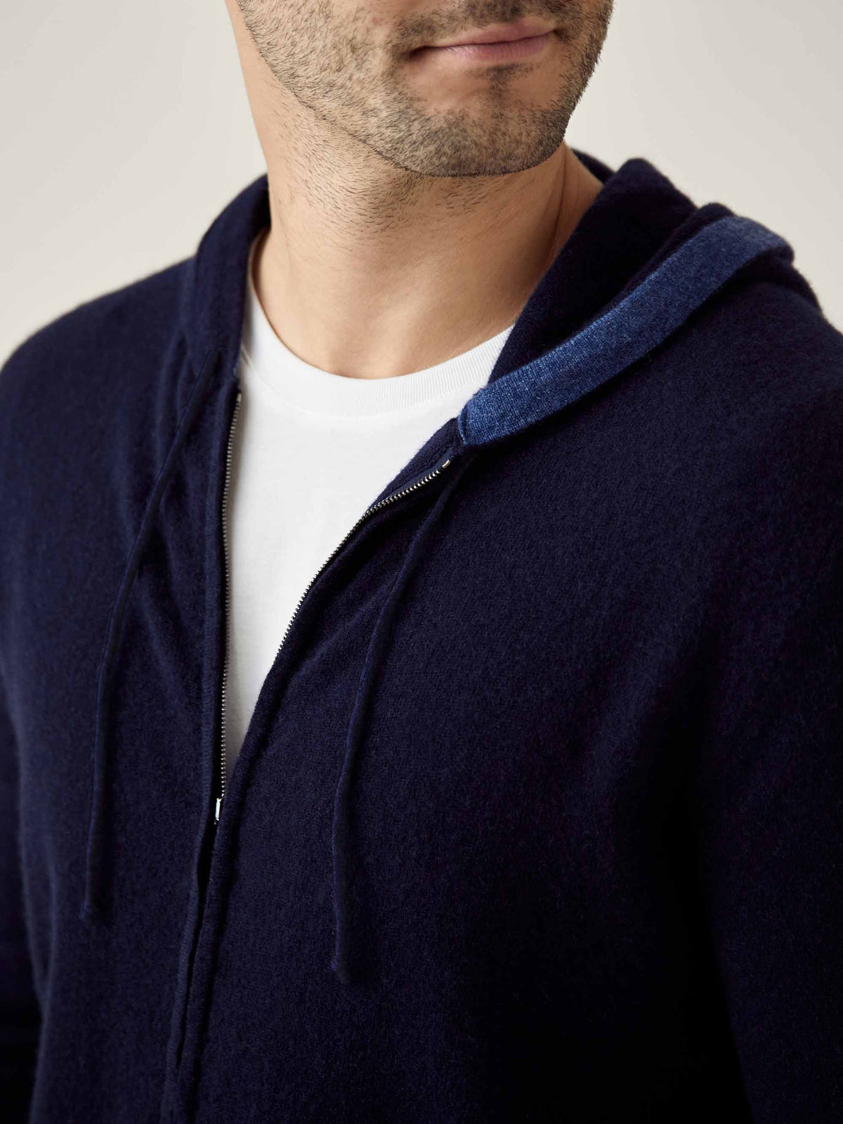 Close-up on a model wearing the Midnight Blue Cashmere Zip Hoodie, highlighting the soft texture and zipper detail.