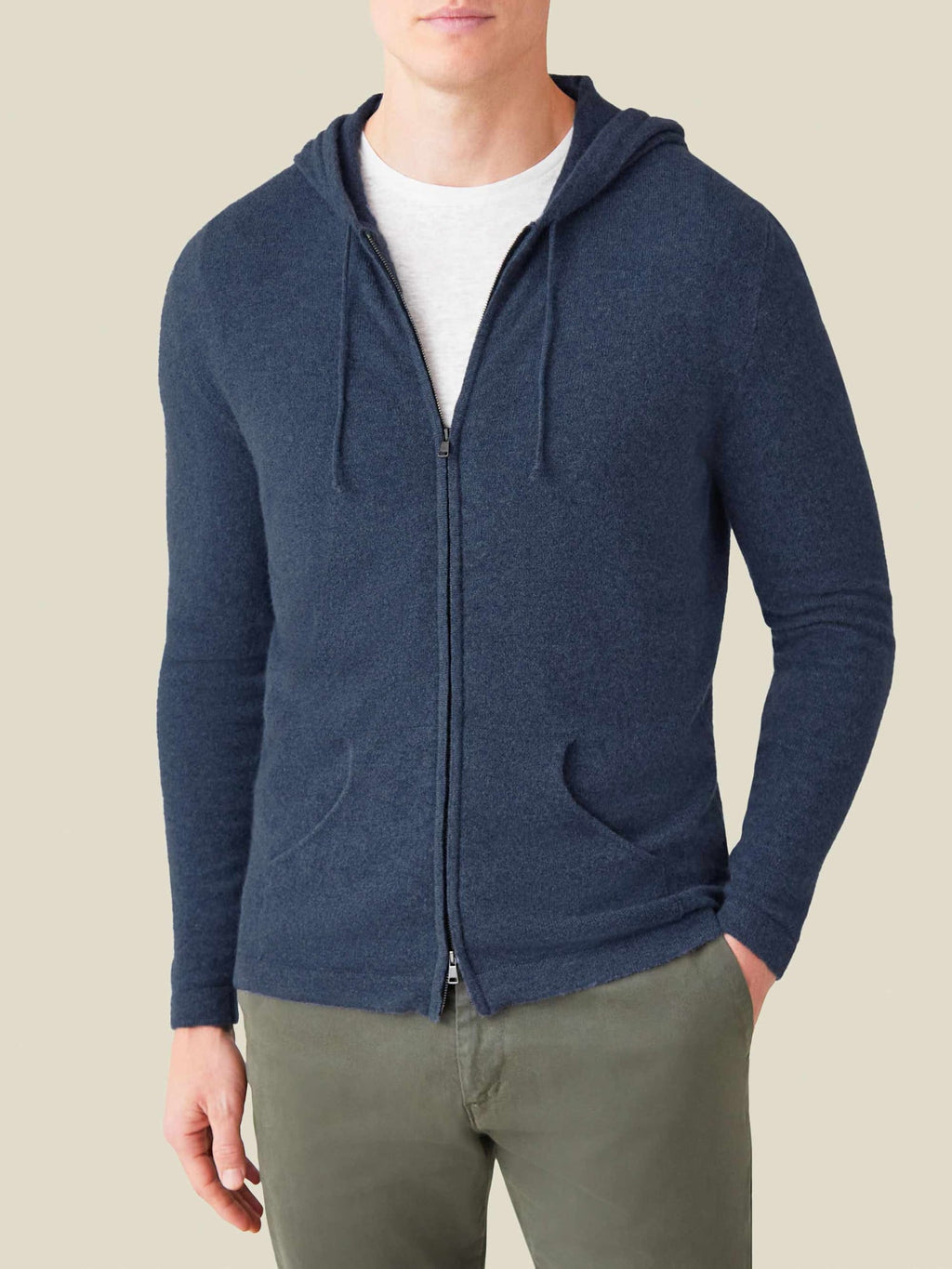Front view of a man wearing the Luca Faloni Cashmere Zip Hoodie in Atlantic Blue over a white t-shirt.
