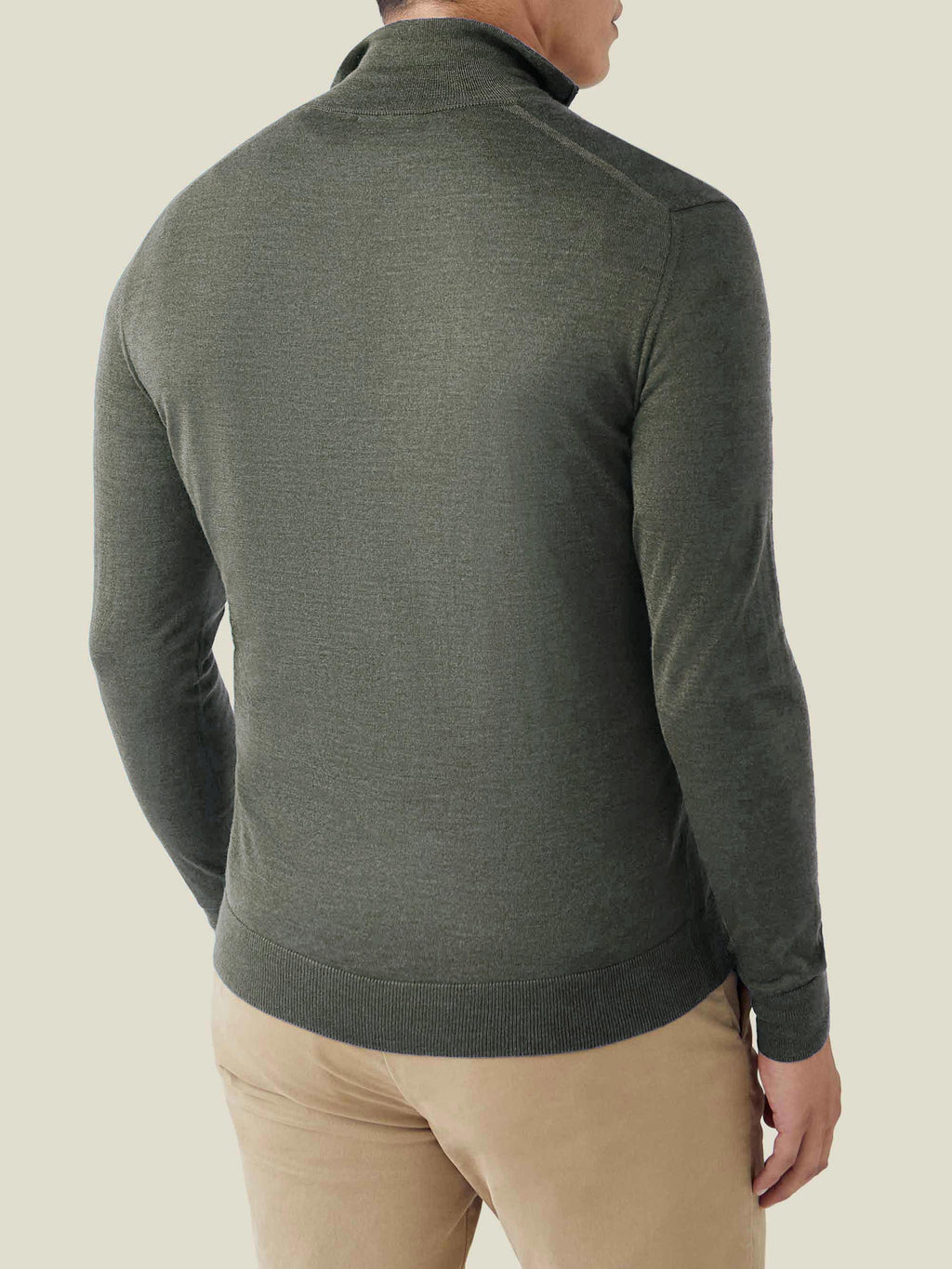 Back three-quarter view of a man wearing a Moss Green Silk-Cashmere Zip-up, showcasing its sleek fit and silhouette.