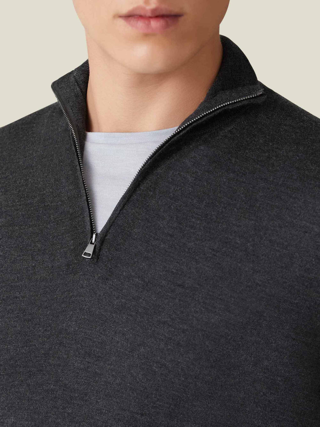 A close-up of the Charcoal Grey Silk-Cashmere Zip-up, detailing the premium zipper, ribbed collar, and fine knit.