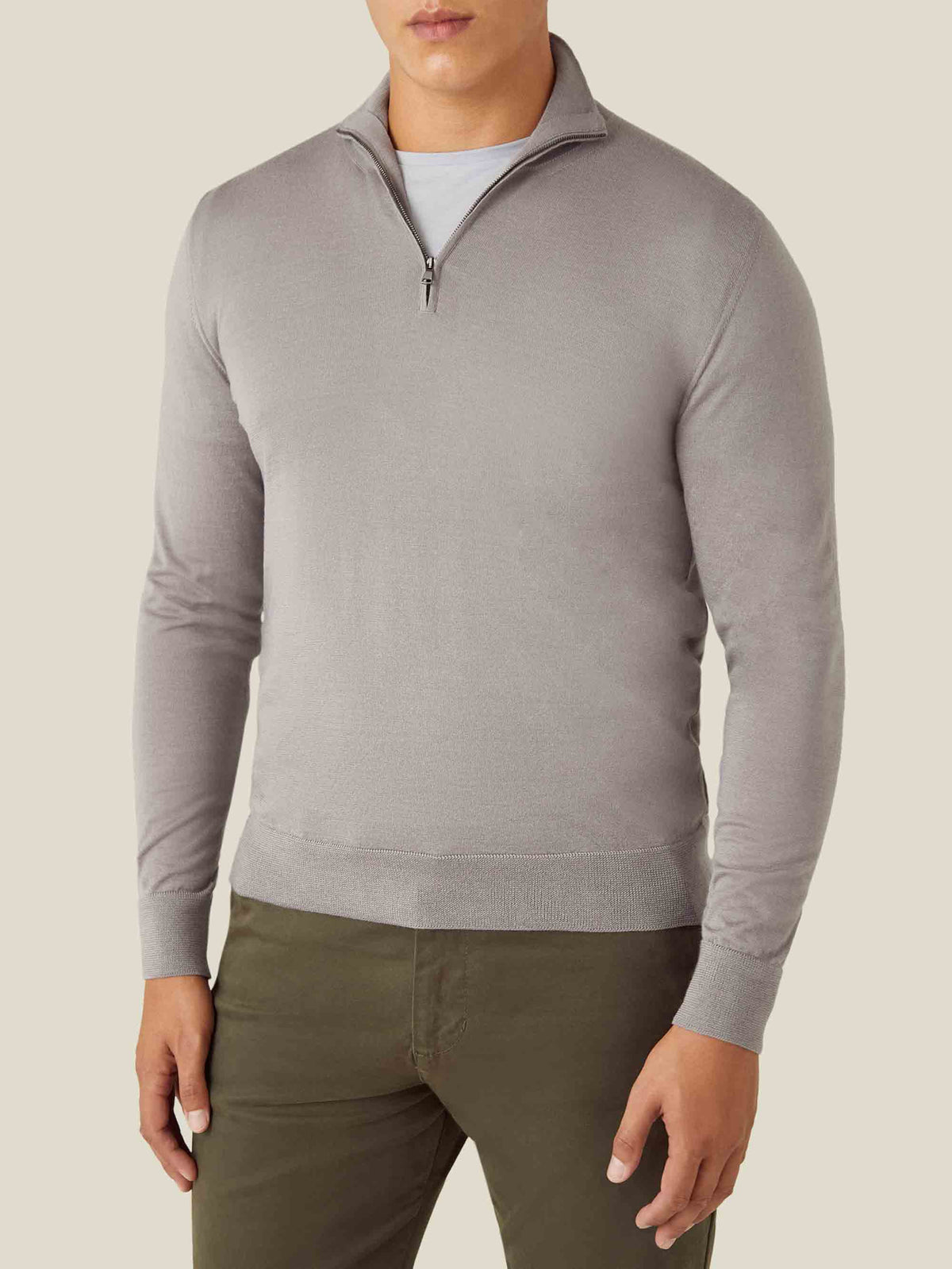 Front view of a model wearing the Luca Faloni Silk-Cashmere Zip-up in Nocciola Brown, layered over a grey t-shirt.