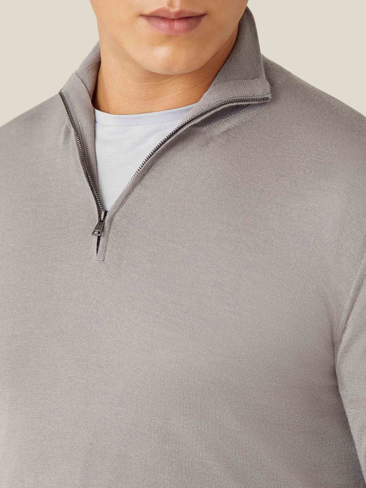 Detailed view of the Nocciola Brown Silk-Cashmere Zip-up's collar and half-zip, worn by a model over a white t-shirt.