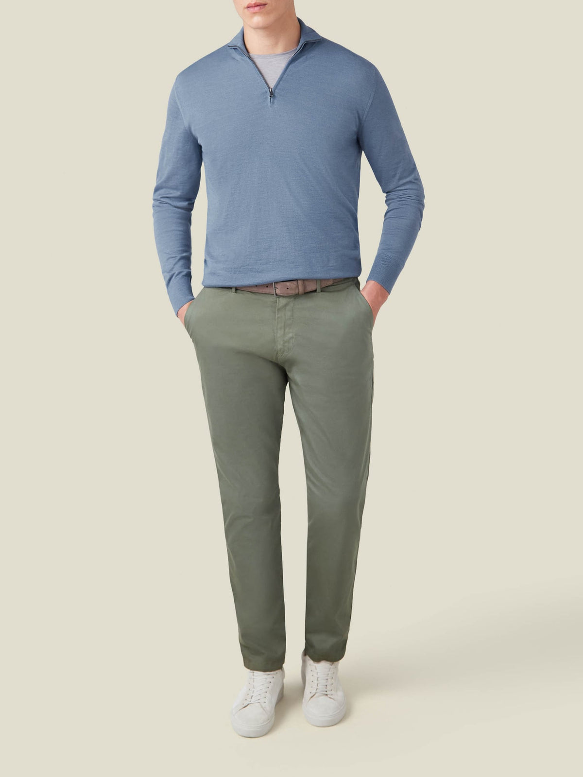 Front view of a model wearing the Luca Faloni Azure Silk-Cashmere Zip-up with green chinos and white sneakers.