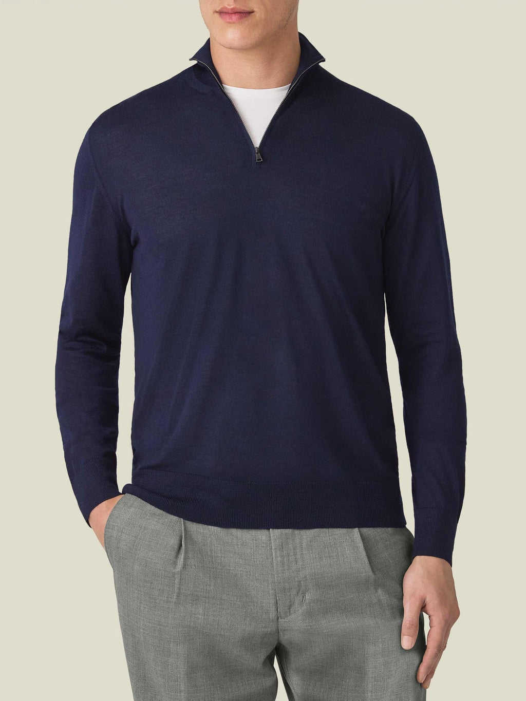 Front view of a man wearing the Luca Faloni Silk-Cashmere Zip-up in navy blue, styled with grey trousers.