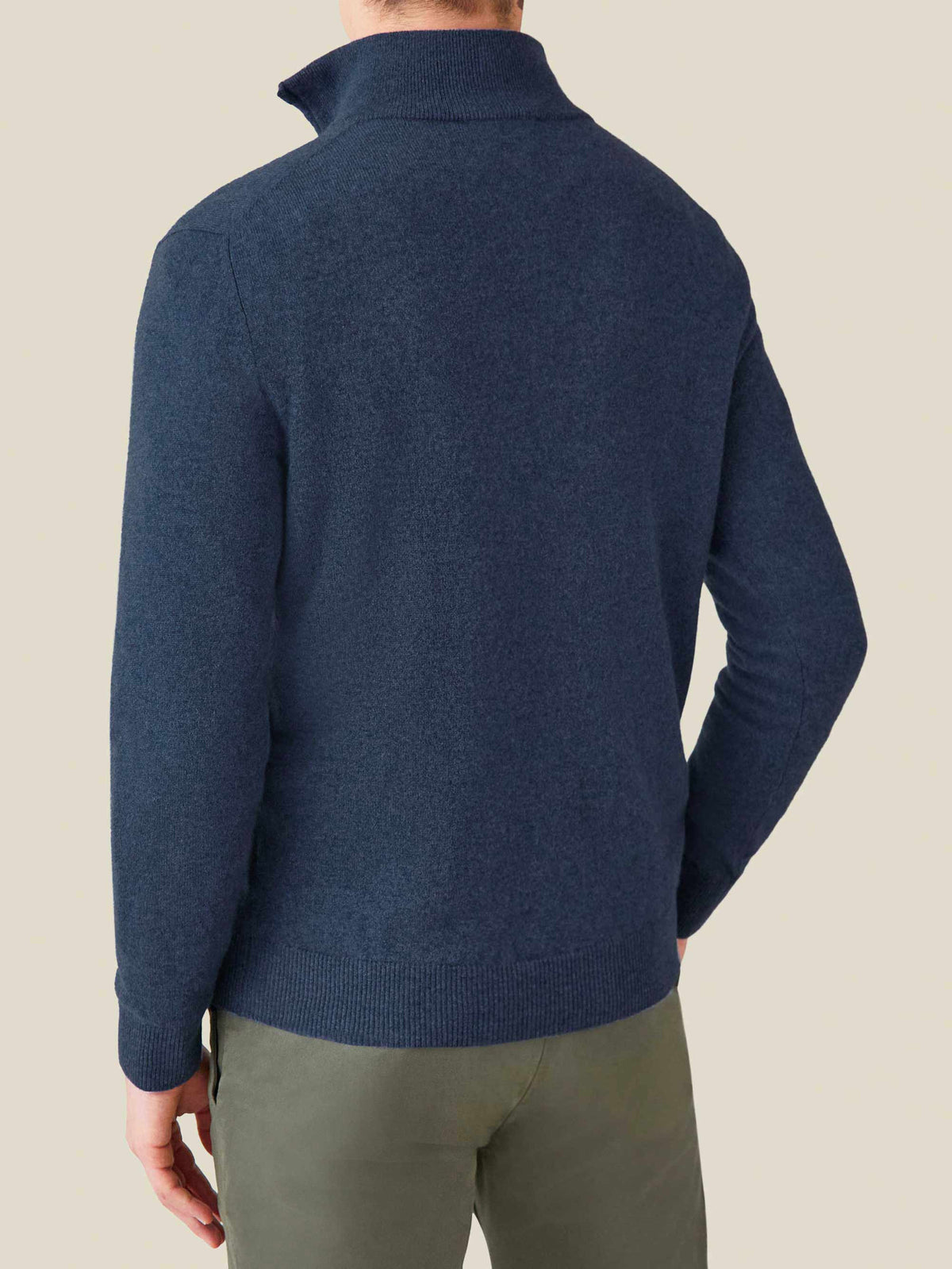 Back view of a man wearing the Luca Faloni Cashmere Zip-up in Atlantic Blue, showing the funnel neck collar and ribbed hem.