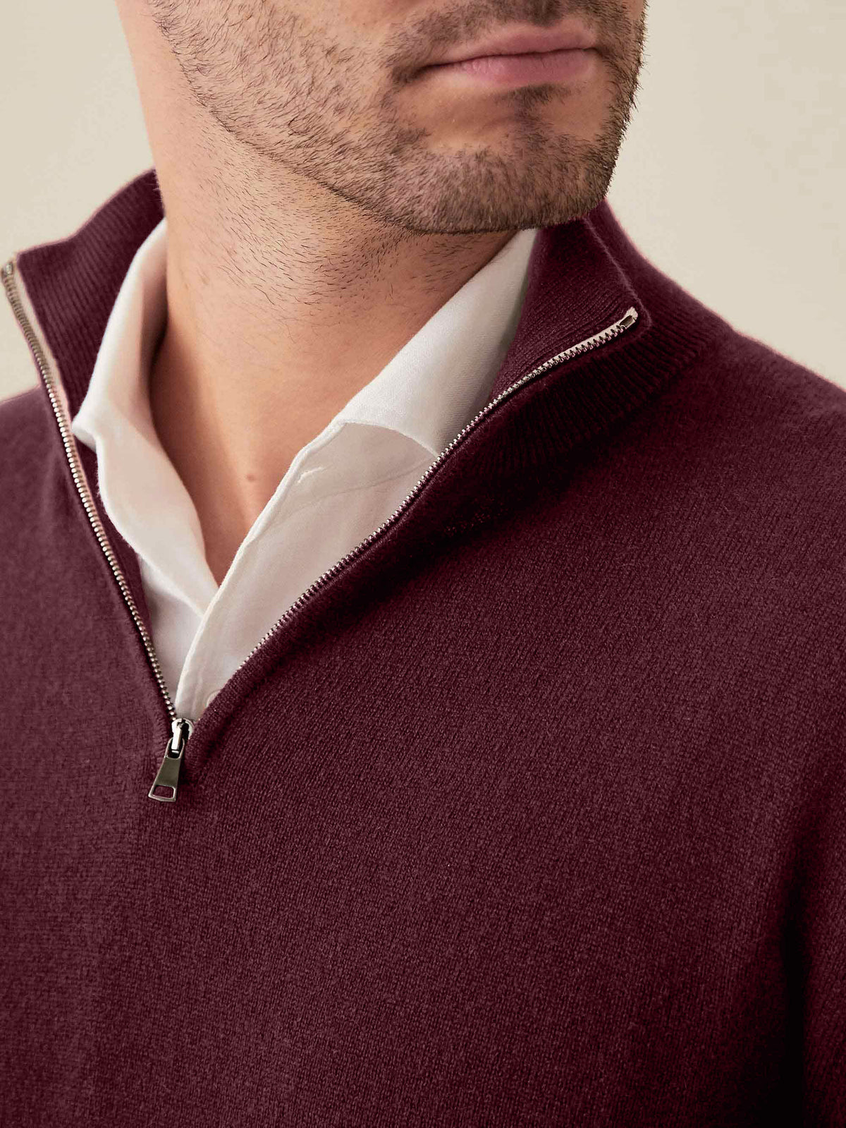 Close-up of the Luca Faloni Cashmere Zip-up in grape, showing the collar and zip detail.