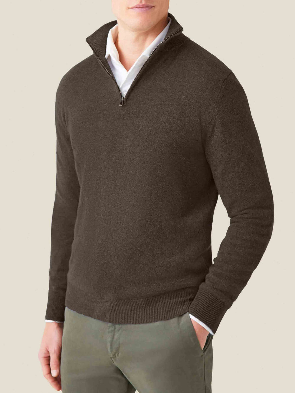 Model wearing the Luca Faloni chocolate brown cashmere zip-up sweater, layered over a white collared shirt.