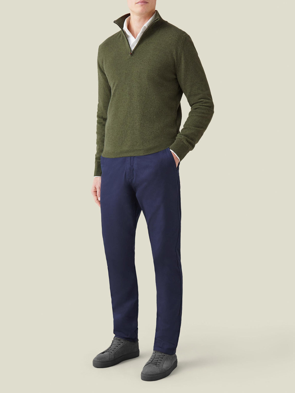 Full outfit view of a model wearing the Hunting Green Cashmere Zip-up with navy trousers and a white collared shirt.