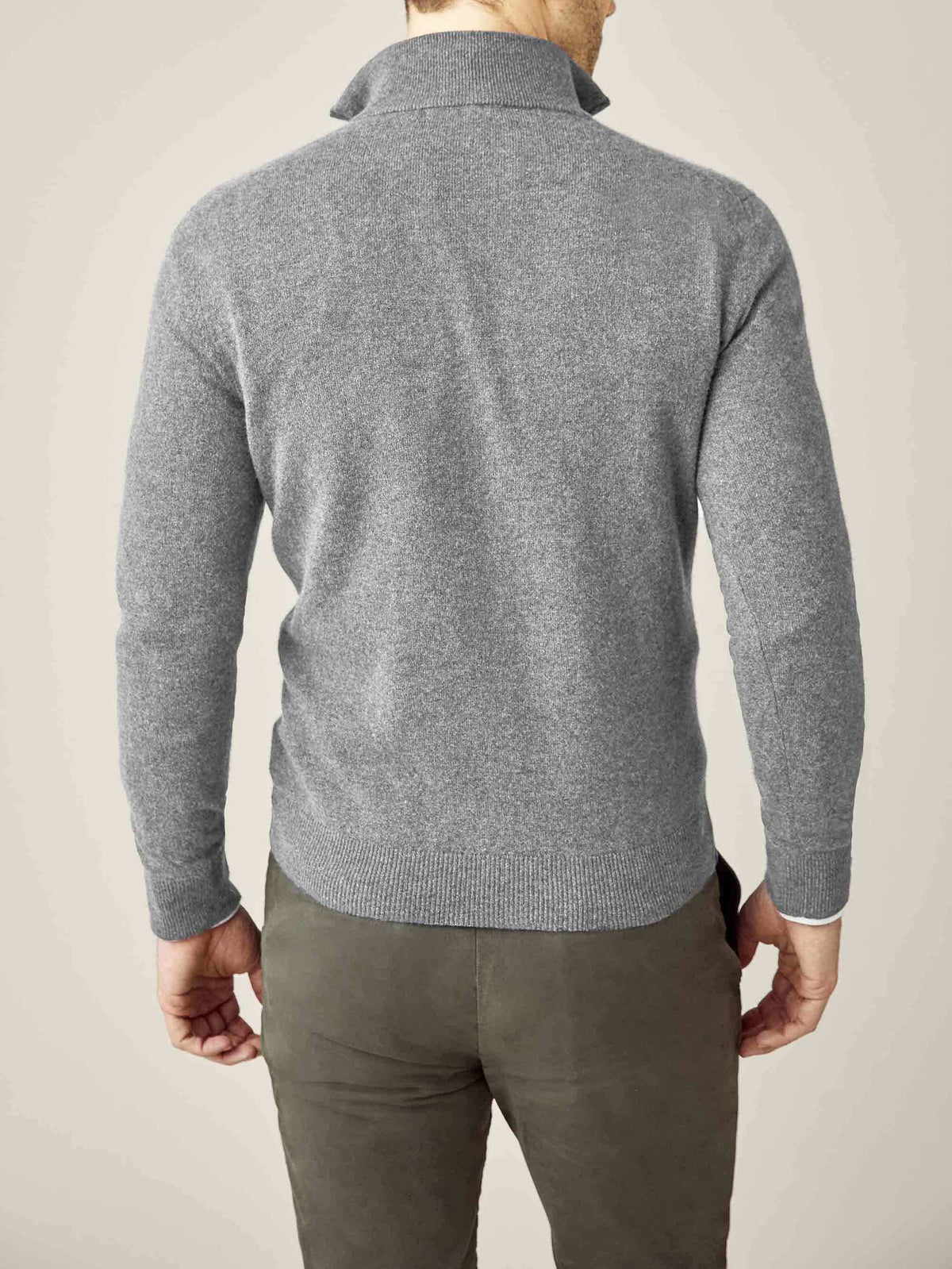 Back view of a model wearing Luca Faloni's Dolomiti Grey pure cashmere zip-up sweater.