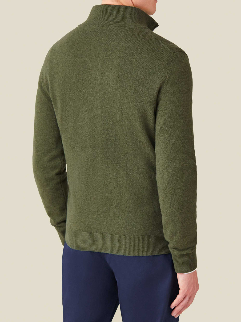 Back view of a man wearing the Hunting Green Cashmere Zip-Up, showcasing the fit and funnel collar.