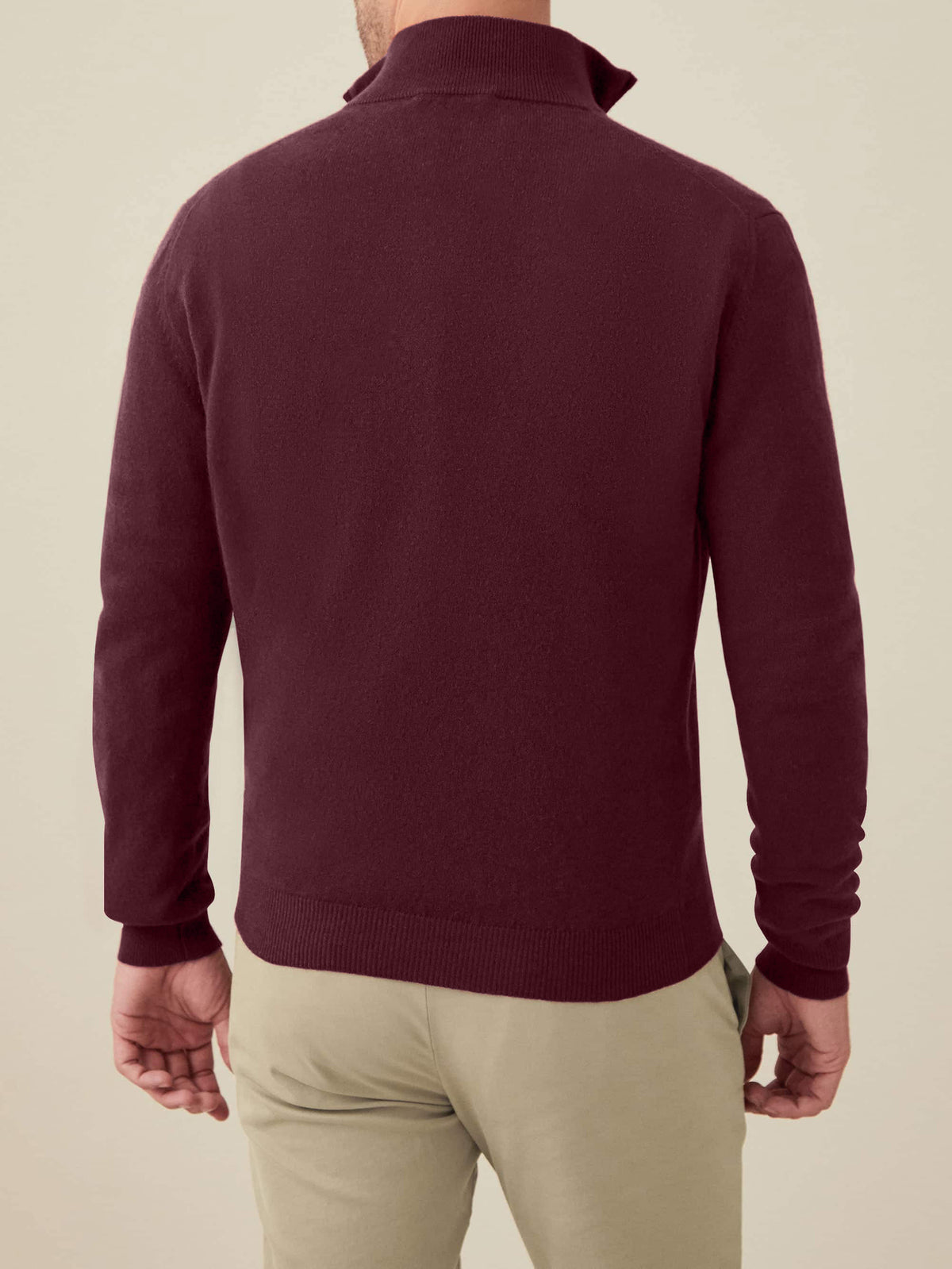 Back view of a model wearing the Luca Faloni Cashmere Zip-up in grape.