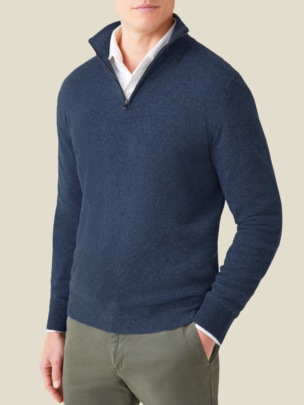 Front view of a man wearing the Luca Faloni Cashmere Zip-up in Atlantic Blue over a white shirt and olive green chinos.
