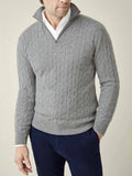 A man wears the Cable Knit Zip-up in Dolomiti Grey cashmere over a white shirt.