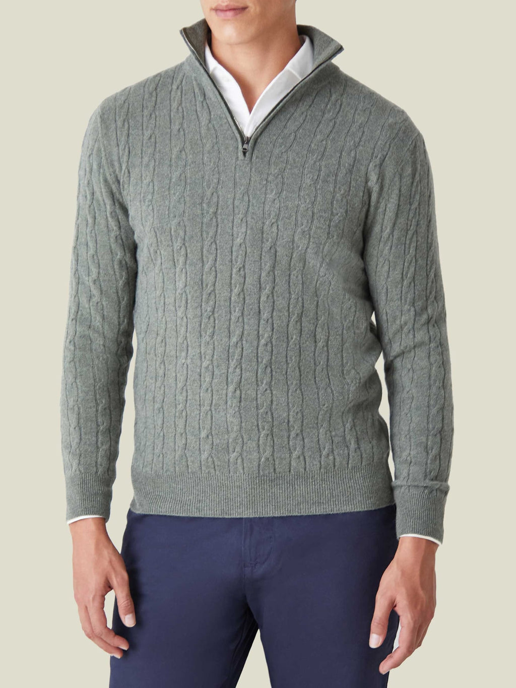 Model wearing the Luca Faloni Moss Green Cable Knit Zip-up over a white shirt with navy trousers, shown from the front.