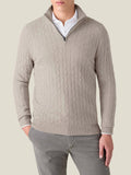 Front view of a model wearing the Luca Faloni Cable Knit Zip-up in almond over a white shirt.