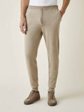 Model wearing the Luca Faloni Cashmere Joggers in Camel Beige. Front view highlighting the tapered fit and drawstring waist.