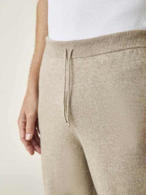 A close-up of the Luca Faloni Camel Beige Cashmere Joggers, highlighting the ribbed waistband and drawstring detail.