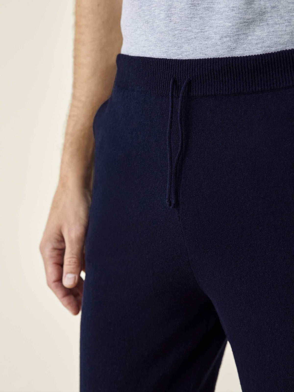Close-up of a model wearing Luca Faloni Midnight Blue Cashmere Joggers, showing the ribbed waistband and drawstring.