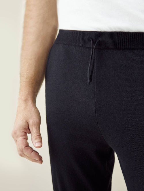 Close-up of the drawstring waist and fine knit texture of the Luca Faloni black cashmere joggers.