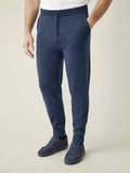 A model wearing Atlantic Blue Cashmere Joggers, showcasing the tapered fit and styled with matching sneakers.