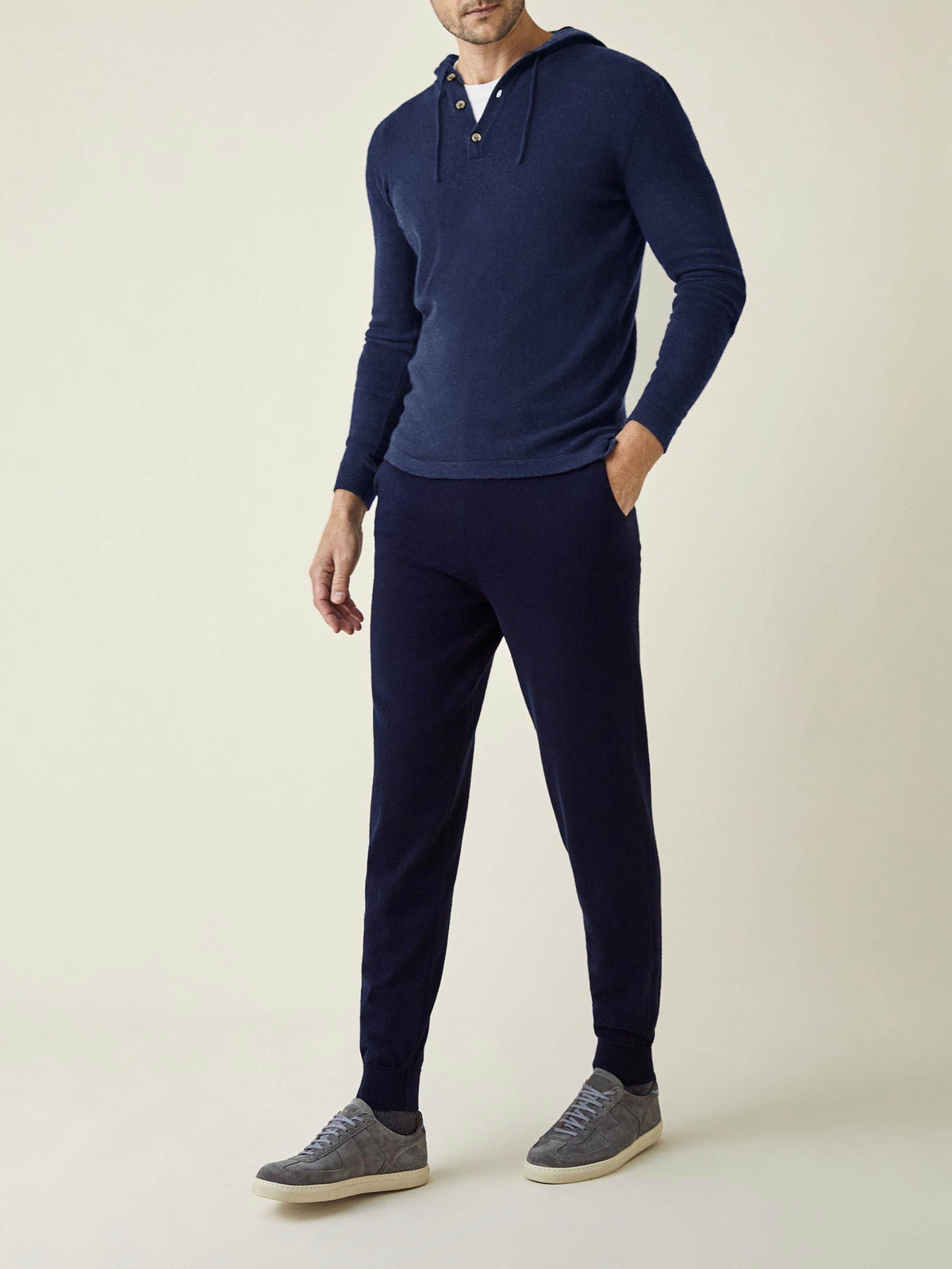 A model wears the Midnight Blue Cashmere Joggers with a matching hoodie, creating a comfortable and stylish loungewear set.