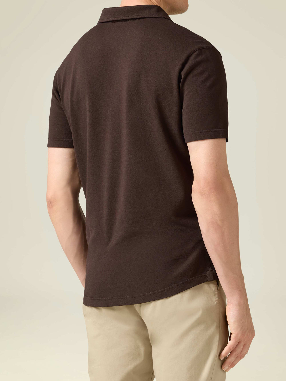 Back view of a model wearing the Luca Faloni Classic Piqué Polo in Chocolate Brown.