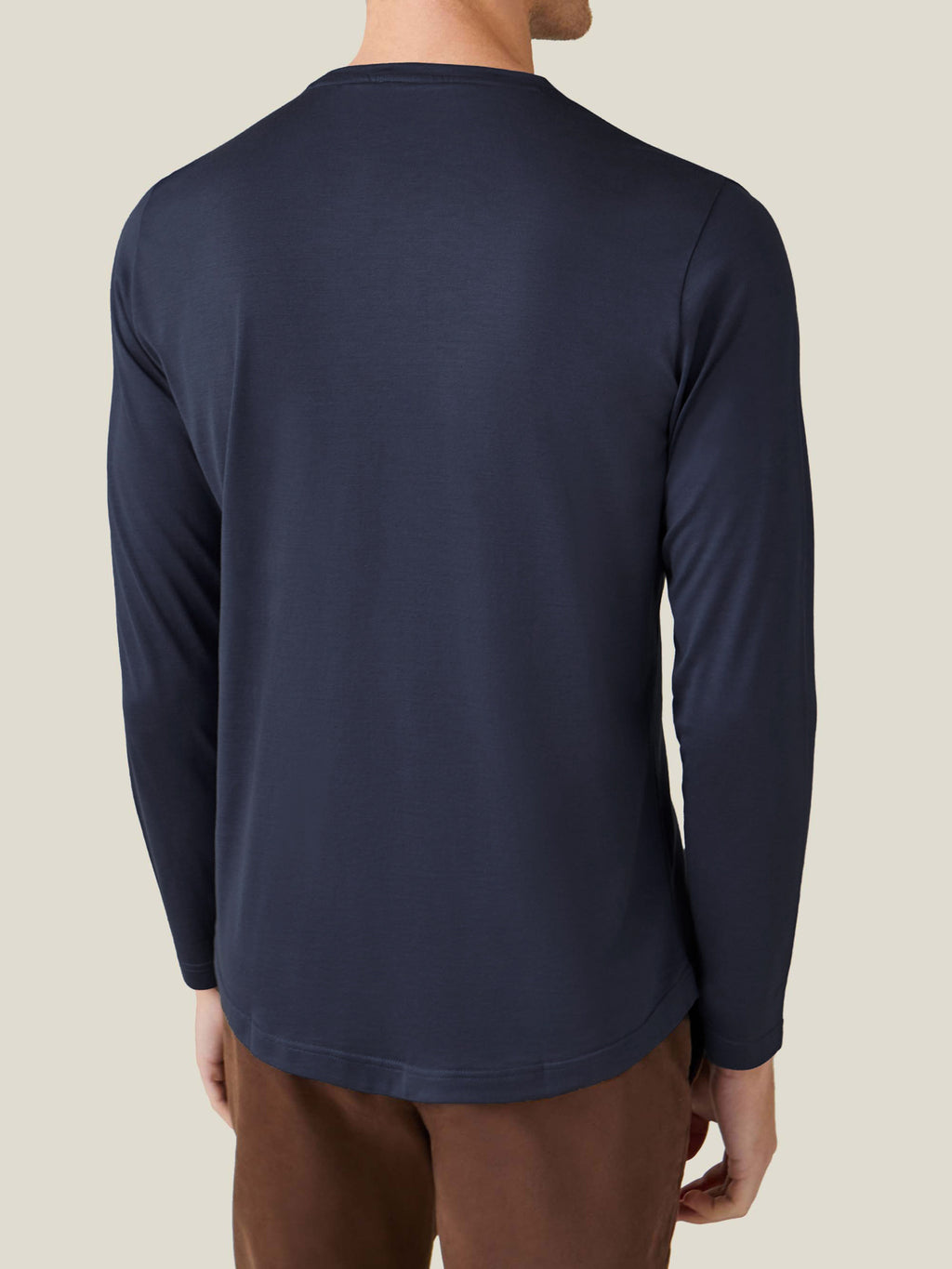 Back view of a model wearing the Luca Faloni Long-Sleeved Silk-Cotton T-Shirt in Midnight Blue, showcasing the relaxed fit.