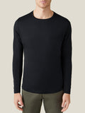 Front view of a model wearing the black silk-cotton long-sleeved T-shirt by Luca Faloni.