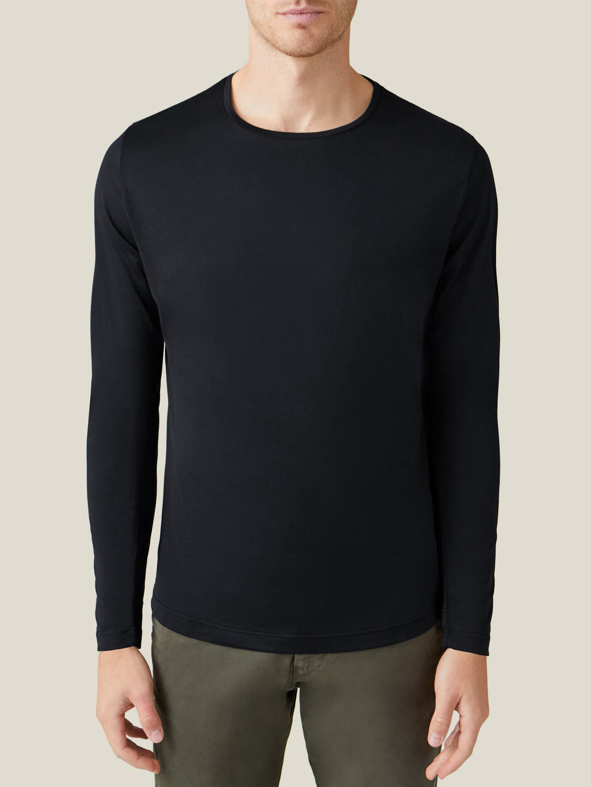 Front view of a model wearing the black silk-cotton long-sleeved T-shirt by Luca Faloni.