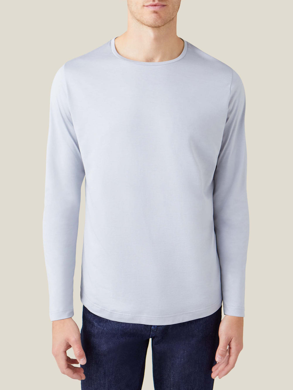 Front view of a man wearing the light grey silk-cotton long-sleeved T-shirt by Luca Faloni.