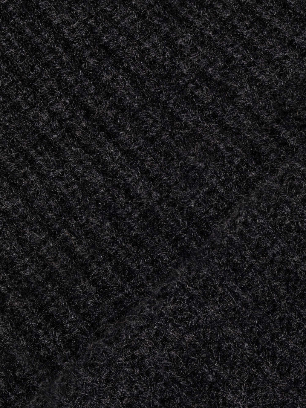 Close-up of the chunky rib-knit texture of the Luca Faloni charcoal grey cashmere beanie.