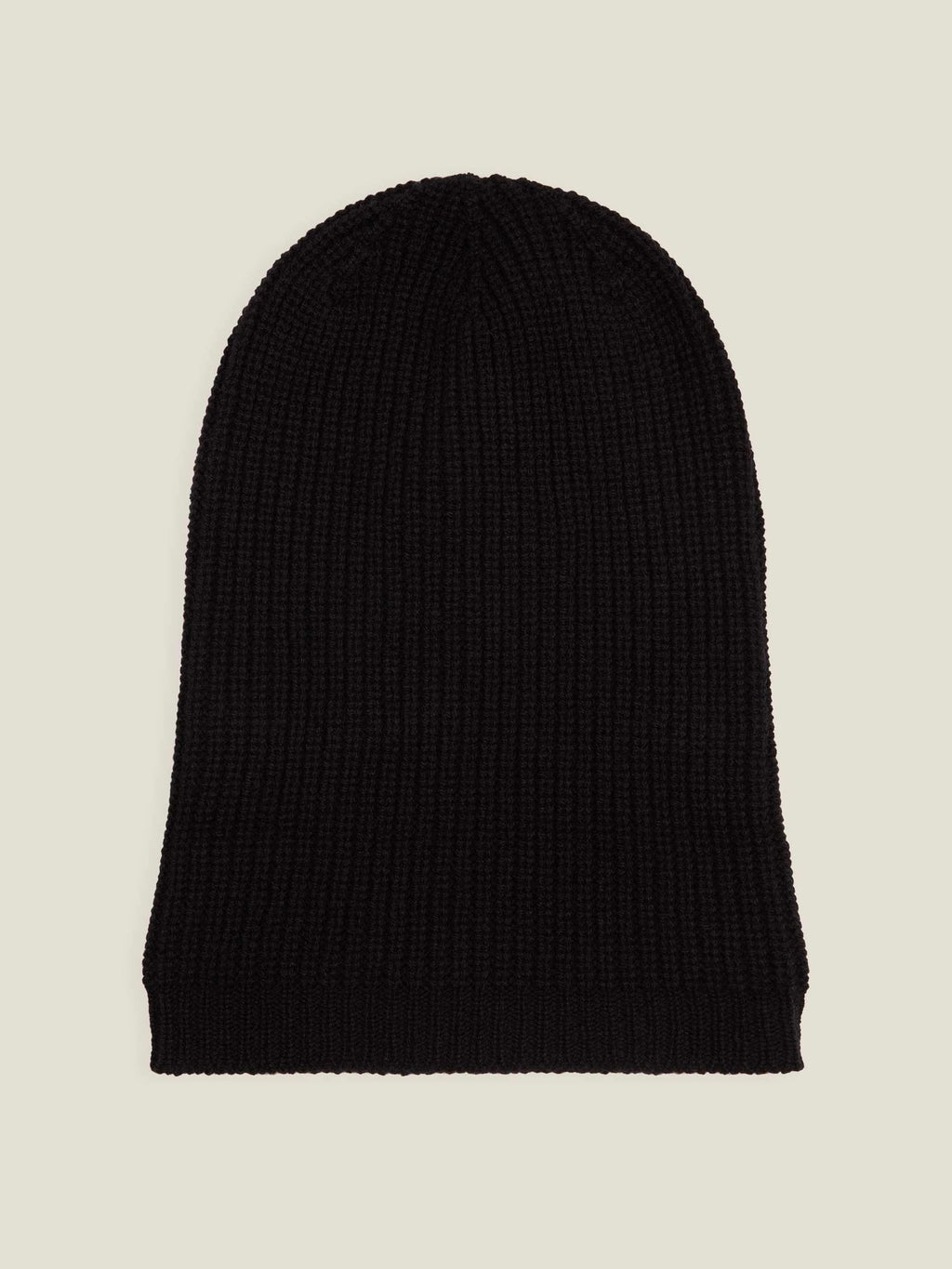 Luca Faloni's black chunky knit cashmere beanie laid flat, highlighting its fine ribbed texture and generous length.